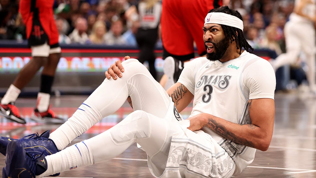 Anthony Davis #3 of the Dallas Mavericks reacts after an injury in the game against the Houston Rockets at American Airlines Center on February 08, 2025 in Dallas, Texas.