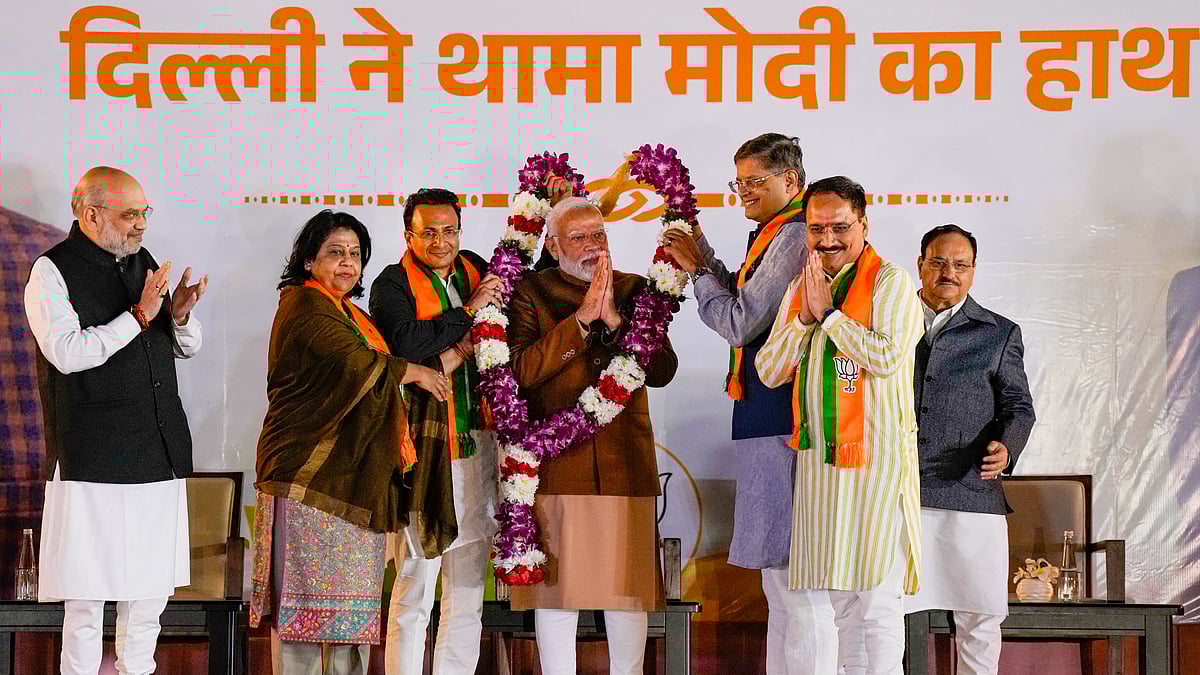 PTI : Narendra Modi being garlanded by Delhi BJP President Virendra Sachdeva, party's National Vice President Baijayant Panda and others during celebrations at the party headquarters after the party won the Delhi Assembly elections, in New Delhi, Saturday, Feb. 8, 2025.