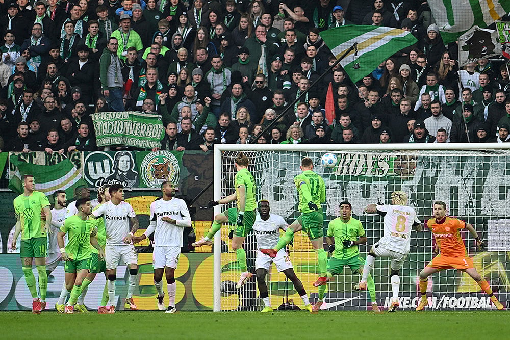| Photo: Swen Pfortner/DPA via AP : Bundesliga: Bayer Leverkusen vs VfL Wolfsburg