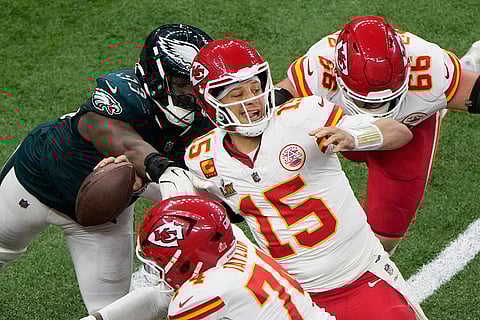 Super Bowl LIX, Eagles vs Chiefs: Eagles defensive tackle Milton Williams (93) strips the ball from Chiefs quarterback Patrick Mahomes