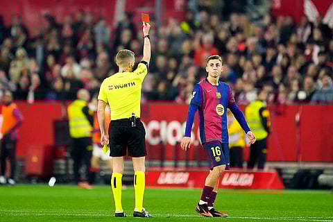 La Liga 2024-25: Referee Alejandro Jose Hernandez shows a red card to Barcelona's Fermin Lopez