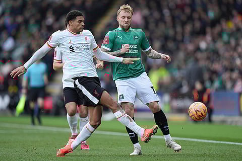 FA Cup Fourth Round: Liverpool's Jarell Quansah challenges for the ball with Plymouth Argyle's Callum Wright