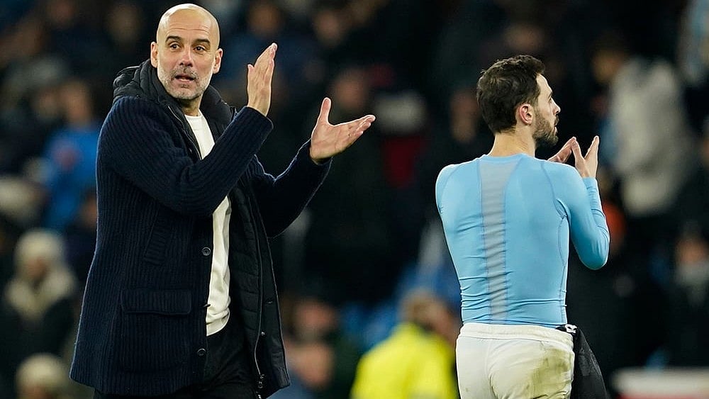 Champions League 2024-25: Pep Guardiola celebrates with Bernardo Silva  - | Photo: AP/Dave Thompson