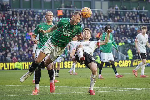 FA Cup Fourth Round: Plymouth Argyle's Nikola Katic, left, clears the ball