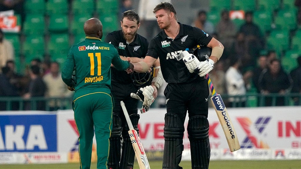 AP : Kane Williamson, centre, and Glenn Phillips, right, shake hands with Temba Bavuma after New Zealand's victory over South Africa.