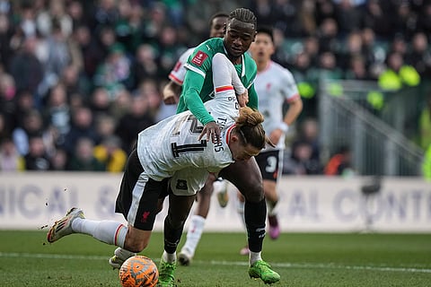FA Cup Fourth Round: Liverpool's Kostas Tsimikas challenges for the ball with Plymouth Argyle's Mustapha Bundu