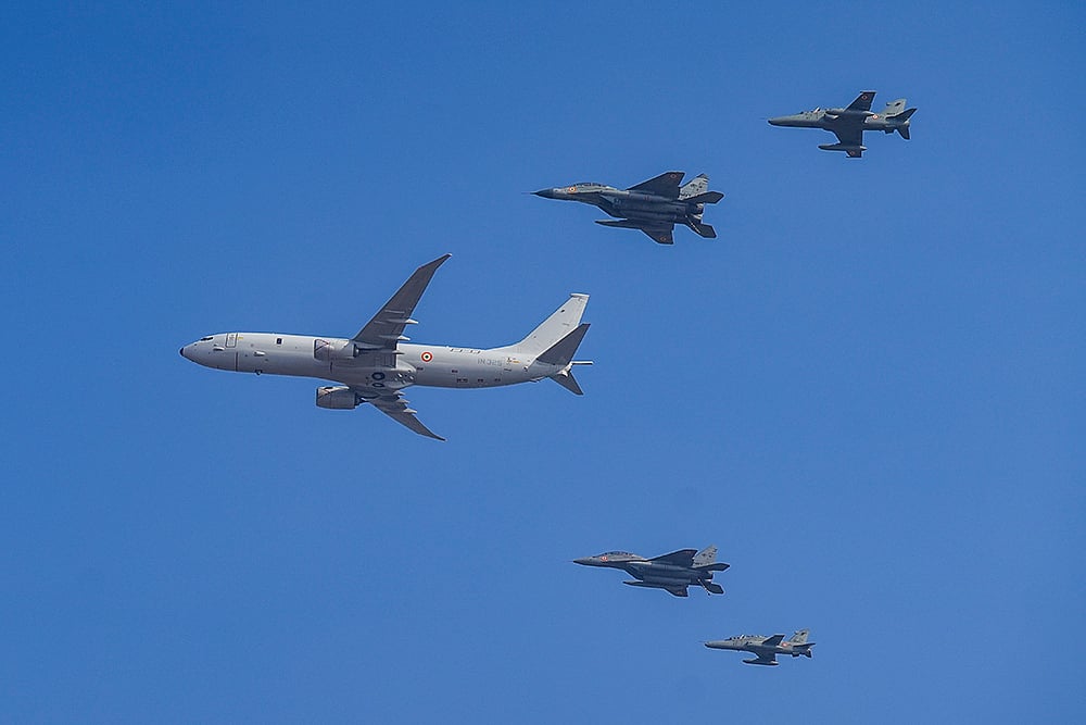 | Photo: PTI/Shailendra Bhojak : 15th Aero India Air show: Varuna formation by P-8i flanked by MIG-29 and Hawk MK-132 planes