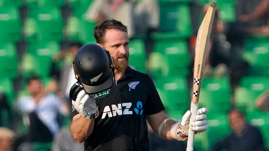 Photo: AP : Kane Williamson celebrates his century for New Zealand against South Africa.