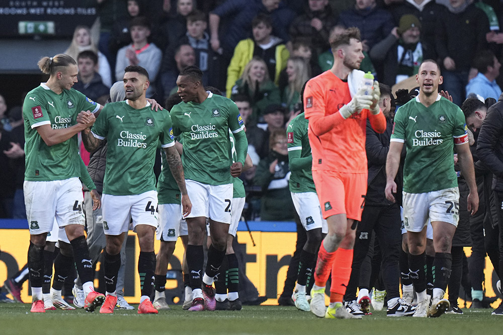 | Photo: AP/Alastair Grant : FA Cup Fourth Round: Plymouth's players celebrate after the match