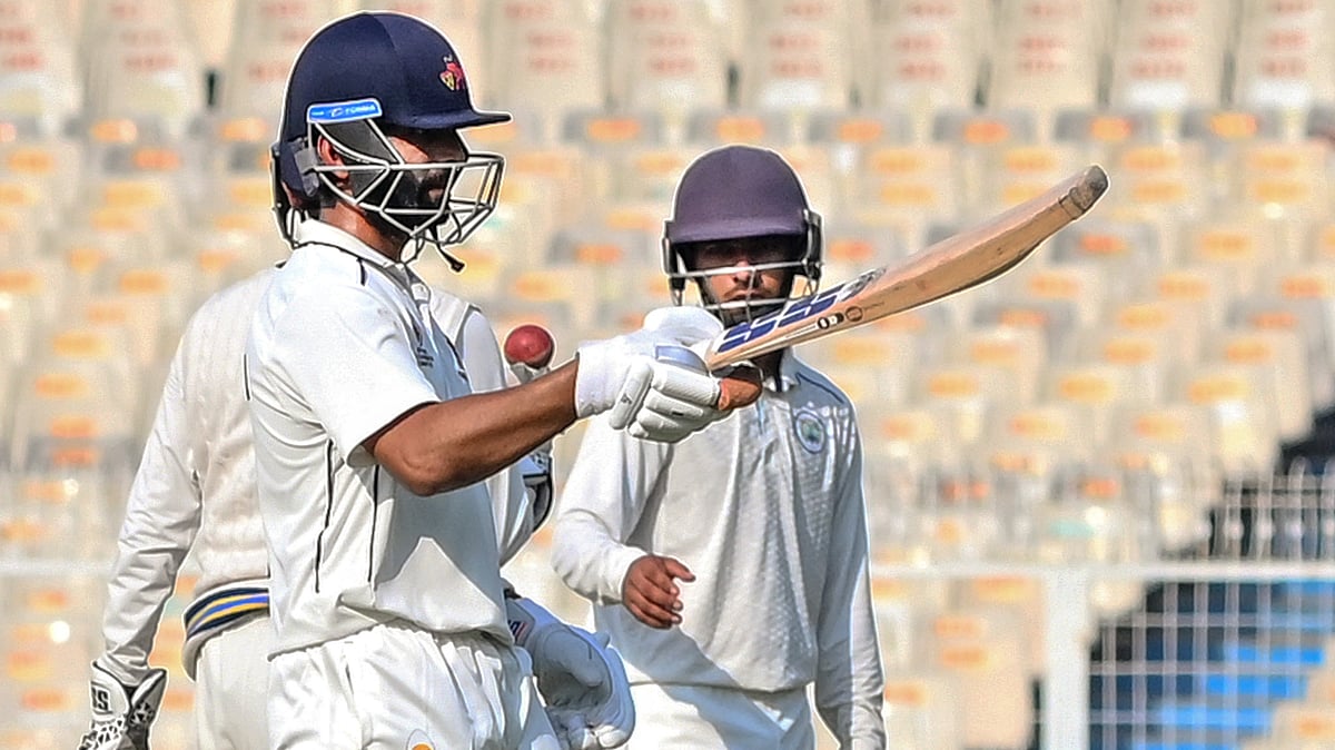 Photo: PTI : Mumbai captain Ajinkya Rahane celebrates his half century during the third day of Ranji Trophy quarter-final cricket match between Mumbai and Haryana, at Eden Gardens.