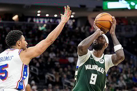 NBA 2024-25: Bucks' Bobby Portis Jr. (9) looks to shoot against 76ers' Quentin Grimes