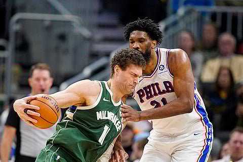 NBA 2024-25: Bucks' Brook Lopez drives against 76ers' Joel Embiid