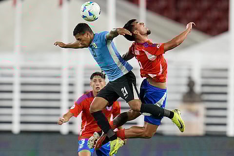 CONMEBOL U20 Championship: Uruguay's Jorge Severo and Chile's Yahir Salazar jump for the ball 