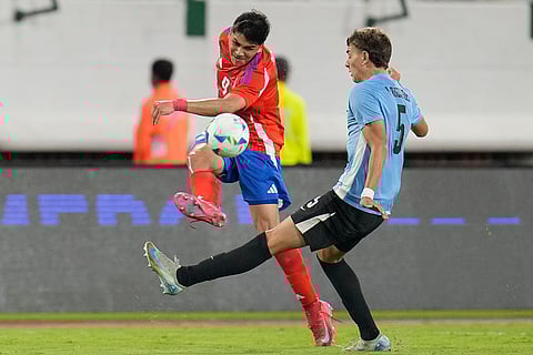 CONMEBOL U20 Championship: Chile's Damian Pizarro and Uruguay's Juan Rodriguez vie for the ball