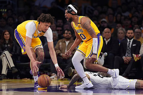 NBA 2024-25: Lakers guard Jordan Goodwin, center, celebrates as turnover 