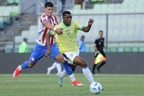 CONMEBOL U20 Championship: Brazil's Rayan controls the ball chased by Paraguay's Axel Balbuena