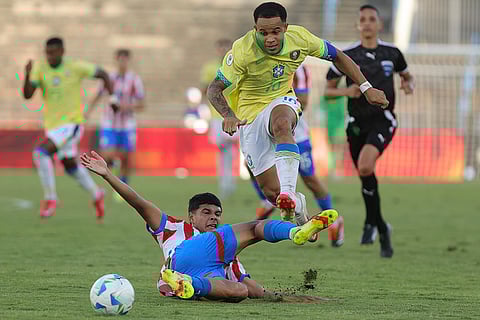 CONMEBOL U20 Championship: Brazil's Pedro Silva jumps over Paraguay's Angel Aguayo 
