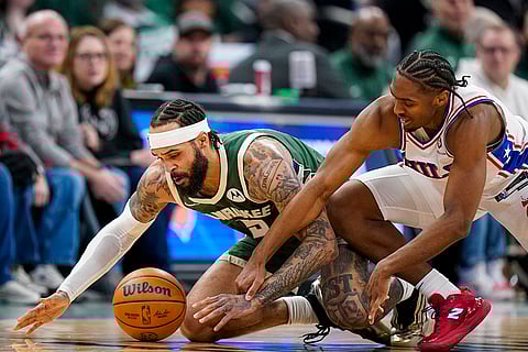 NBA 2024-25: Bucks' Gary Trent Jr. and 76ers' Tyrese Maxey, right, battle for the ball