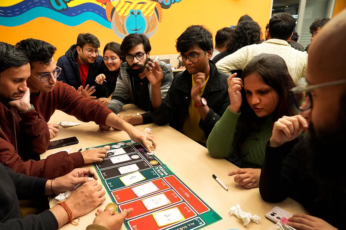 Strangers Playing a Board Game at Whiz Cafe X Thai Fuze, Organised by South Delhi Meetup Community 