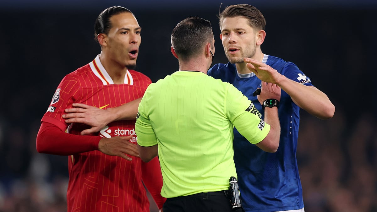 Virgil van Dijk and James Tarkowski approach referee Michael Oliver