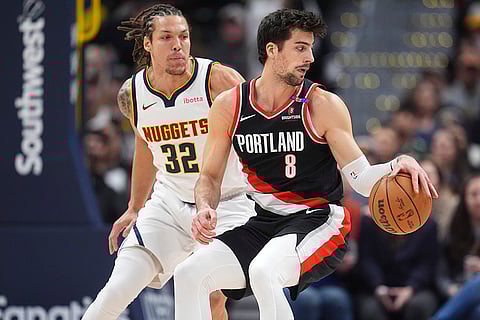 NBA 2024-25: Blazers forward Deni Avdija looks to pass the ball