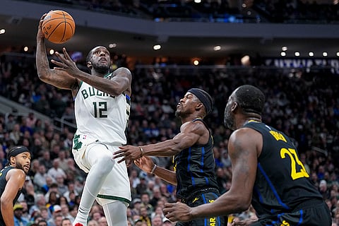 NBA 2024-25: Bucks' Taurean Prince (12) shoots looks to shoot