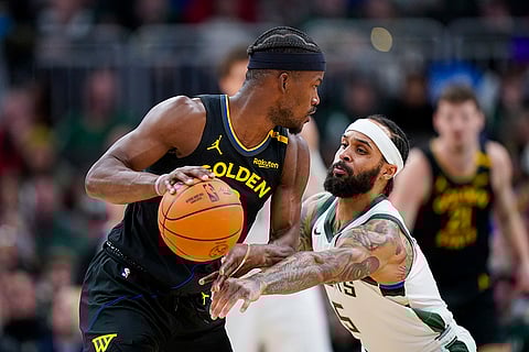 NBA 2024-25: Bucks' Gary Trent Jr. (5) reaches in against Warriors' Jimmy Butler