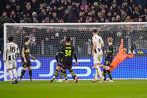 Champions League playoff first leg: Juventus' Weston McKennie, left, scores their side's first goal