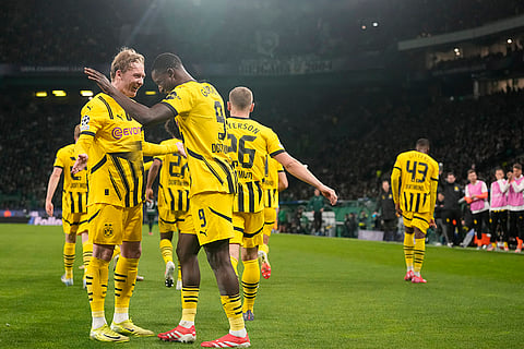 Champions League playoff first leg: Dortmund's Serhou Guirassy celebrates with teammates after scoring his side's opening goal