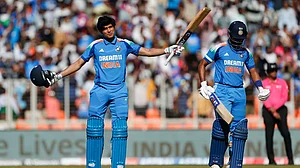 Gill celebrates his century against England