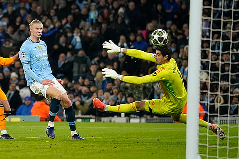 Champions League playoff first leg: Manchester City's Erling Haaland shoots to score past Real Madrid's goalkeeper Thibaut Courtois