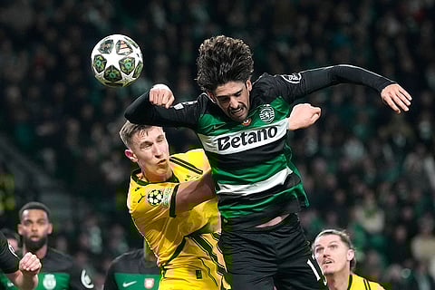 Champions League playoff first leg: Dortmund's Nico Schlotterbeck challenges for the ball with Sporting's Francisco Trincao