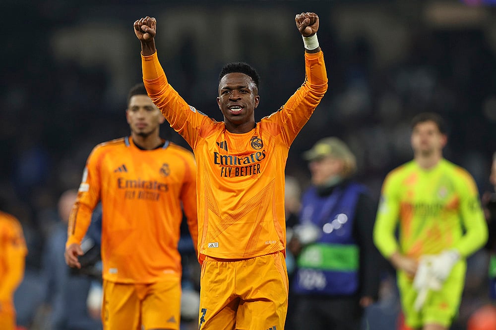 | Photo: AP/Darren Staples : Champions League playoff first leg: Real Madrid's Vinicius Junior greets supporters after winning the match