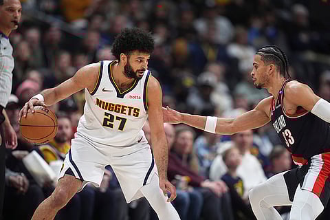 NBA 2024-25: Nuggets guard Jamal Murray, left, looks to pass the ball