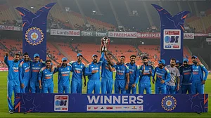 AP Photo/ Ajit Solanki : Indian players pose with the trophy after winning the one-day international cricket series against England in Ahmedabad.