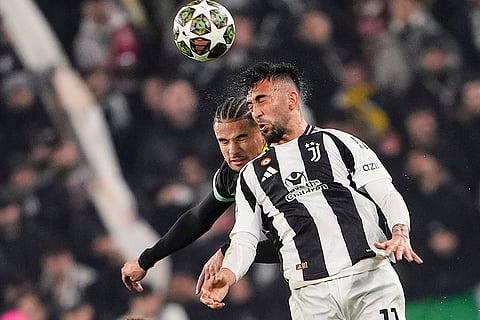 Champions League playoff first leg: Juventus' Nico Gonzalez jumps for the ball with PSV's Armando Obispo