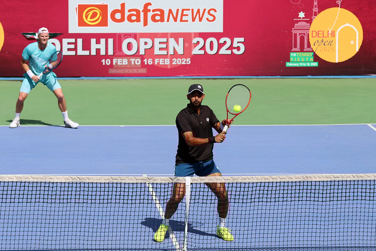 Special Arrangement : Niki Poonacha & John Lock in action at Delhi Open.