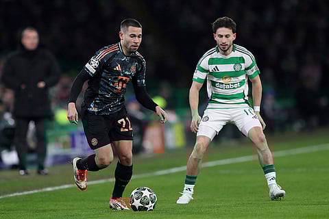 Champions League playoff first leg: Bayern's Raphael Guerreiro controls the ball besides Celtic's Nicolas Kuehn