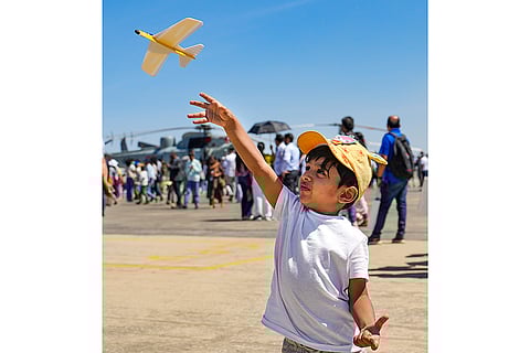 Aero India 2025: A child flies a toy aircraft
