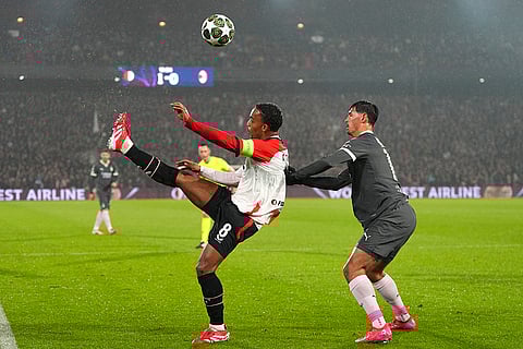 Champions League playoff first leg: Feyenoord's Quinten Timber kicks the ball next to AC Milan's Tijjani Reijnders