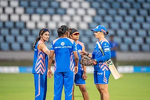 | Photo Courtesy: Mumbai Indians : Fielding Coach Nicole Bolton goes over fielding drills with players at practice