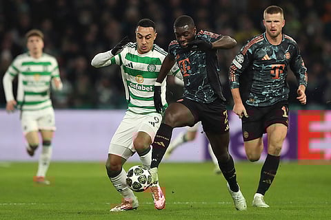 Champions League playoff first leg: Celtic's Adam Idah and Bayern's Dayot Upamecano challenge for the ball