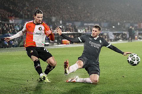 Champions League playoff first leg: AC Milan's Santiago Gimenez tries to stop a cross from Feyenoord's Anis Hadj Moussa