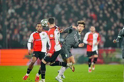 Champions League playoff first leg: AC Milan's Joao Felix challenges for the ball with Feyenoord's Jakub Moder