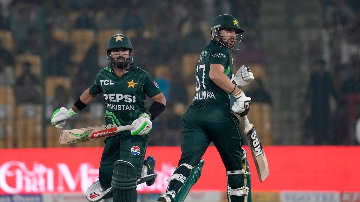 AP Photo/Fareed Khan : Pakistan's Mohammad Rizwan, left, Salman Ali Agha run between the wickets during the tri-series ODI cricket match between Pakistan and South Africa, in Karachi.