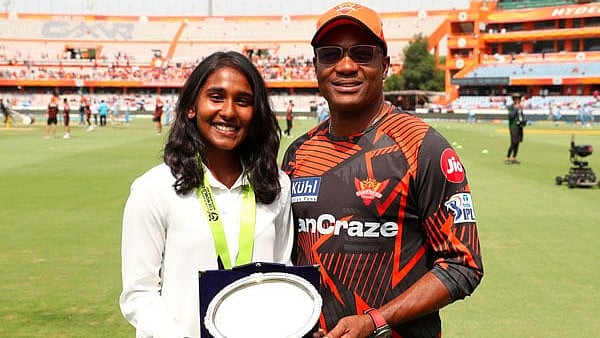 Special Arrangement : Gongadi Trisha with the legendary Brian Lara.