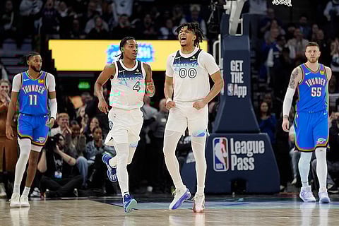 NBA 2024-25: Timberwolves guard Terrence Shannon Jr. (00) celebrates after a shot made by guard Rob Dillingham