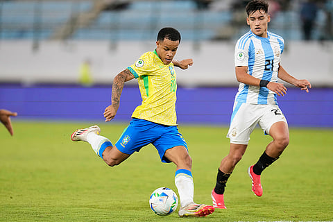 U-20 South American Championship: Brazil's Pedro Silva shoots, with Argentina's Ian Subiabre looking on