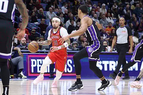 NBA 2024-25: Pelicans guard Jose Alvarado (15) tries to drive past Kings forward Keegan Murray