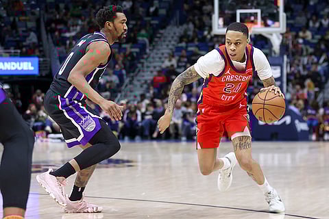 NBA 2024-25: Pelicans guard Jordan Hawkins (24) tries to make a move against Kings guard Malik Monk